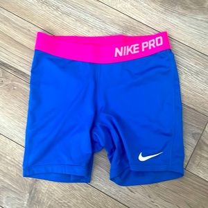 Children’s Nike pro spandex size large, color blue with pink waist band